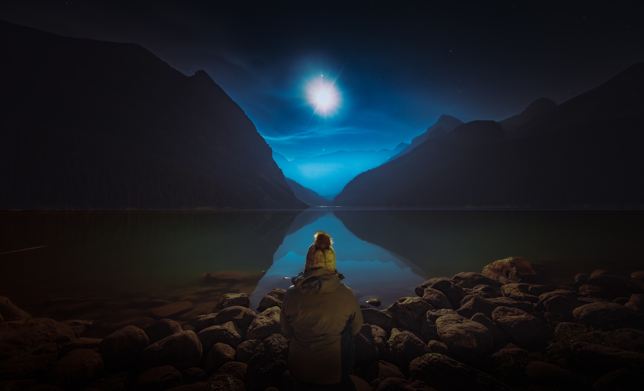 Sitting by a moonlit lake in Banff